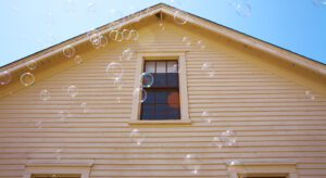 A house with bubbles coming out of the window.