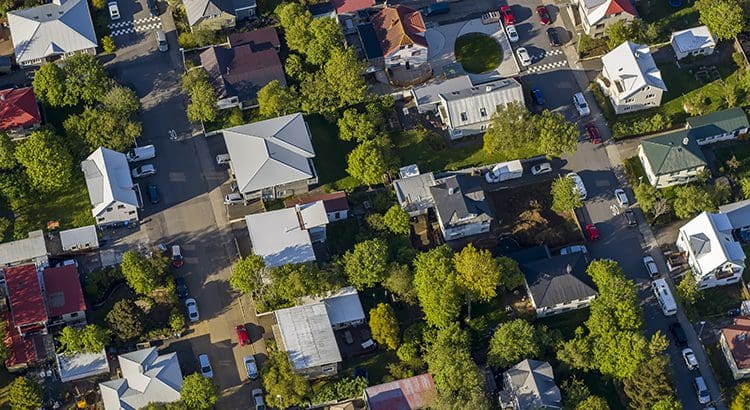A bird 's eye view of houses and trees.