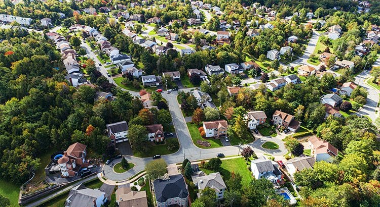 A bird 's eye view of houses and trees.