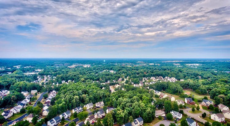 A view of houses and trees from above.