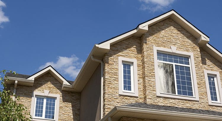 A house with two windows and a sky background