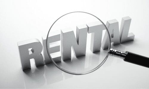 A magnifying glass over the word " rental ".