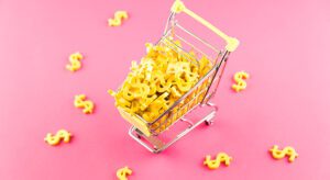 A shopping cart filled with macaroni and cheese.
