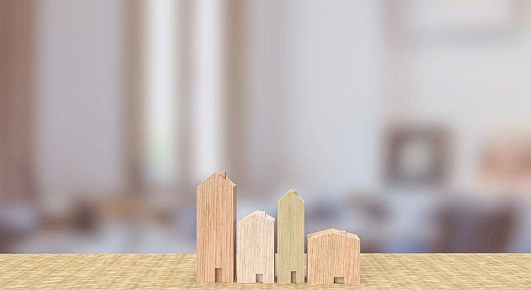 A table with four wooden blocks on it