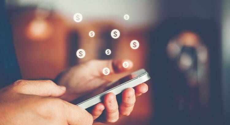 A person holding a smart phone in their hand.