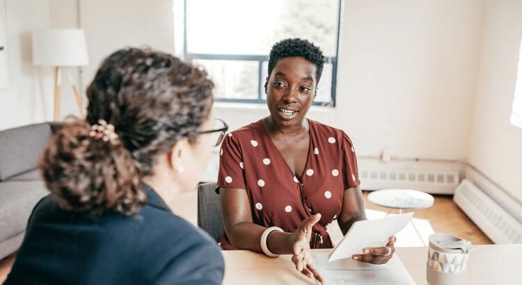 Two women having a business meeting discussion.