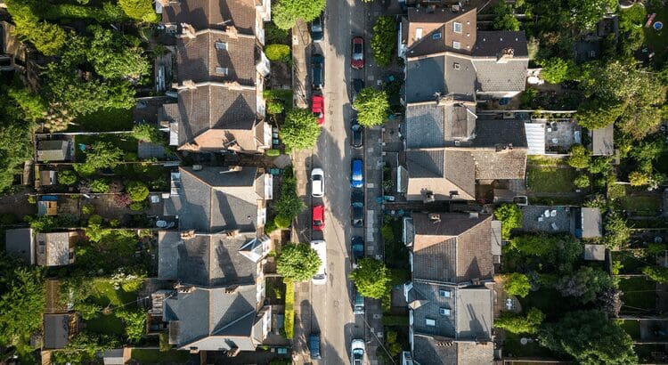 Aerial view of suburban houses and street.