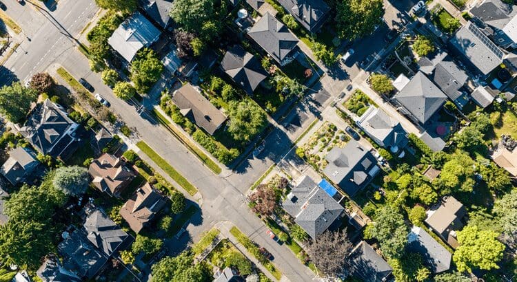 Aerial view of suburban neighborhood with trees.