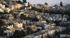 Hillside with rows of colorful houses.