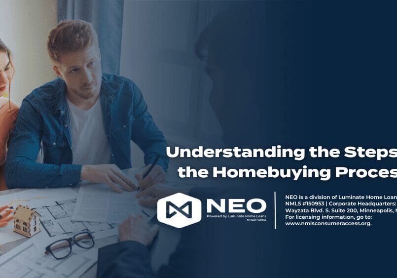 A man sitting at a table with papers in front of him.