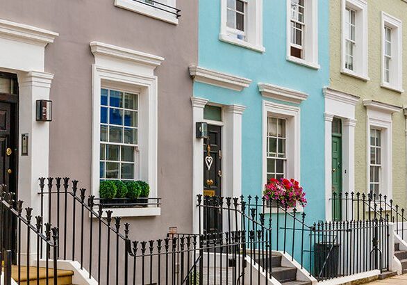 Street in residential district with row houses in London, UK