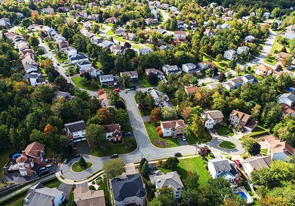 An aerial drone view of a suburban landscape.