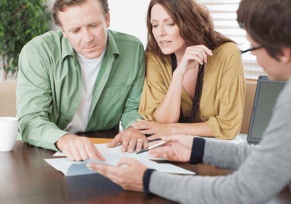 Couple consulting with a financial advisor.