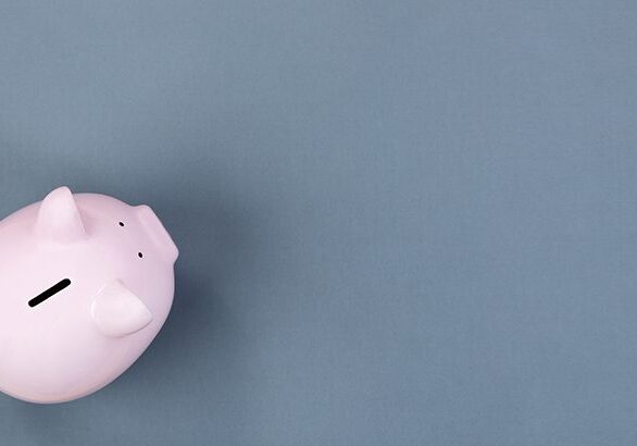 Piggy Bank on gray desktop with copy space