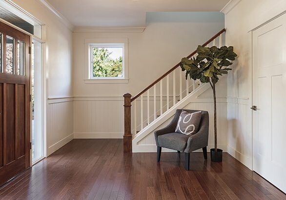 Armchair and tree in house entryway