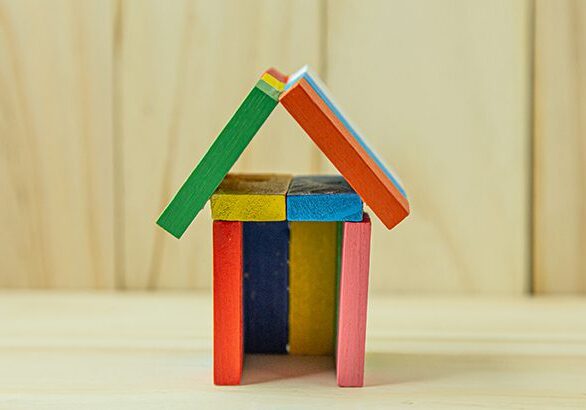 The home toy on wood for property content.