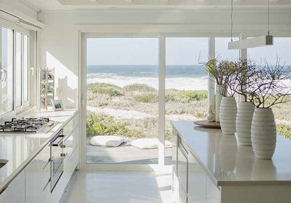 Modern white kitchen with ocean view