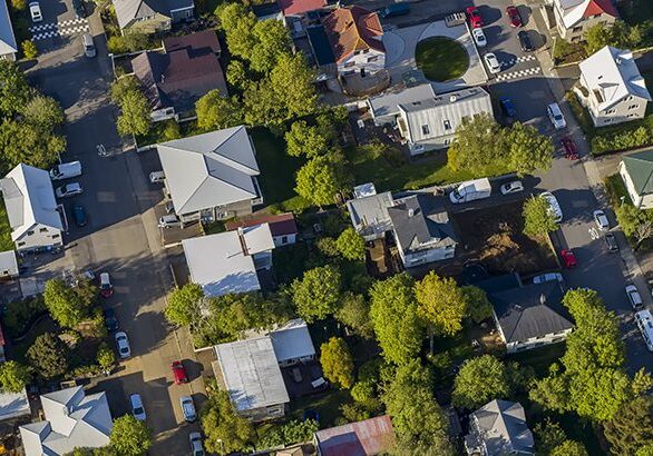A bird 's eye view of houses and trees.