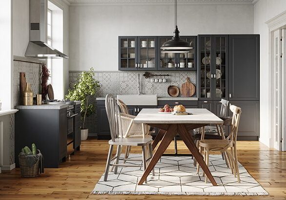 A kitchen with a table and chairs in it