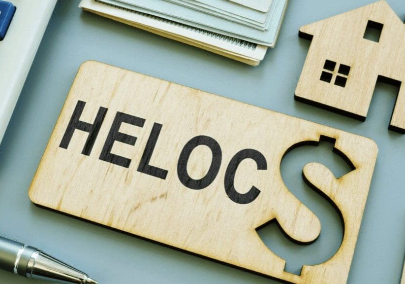 A wooden sign with the word heloc on it.