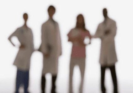 A group of doctors standing in front of each other.