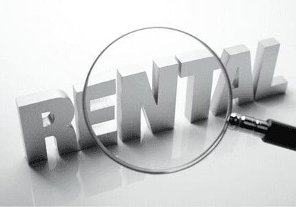 A magnifying glass over the word " rental ".