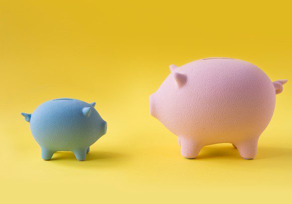 Blue and pink piggy banks on yellow background.